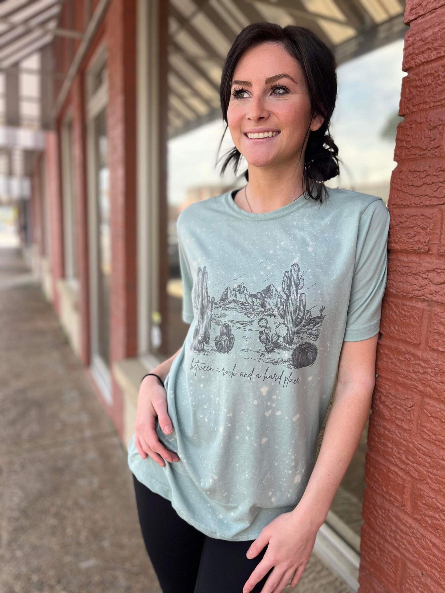 between a rock and a hard place tee ask apparel